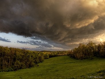 Rolling storm clouds over open field Picture